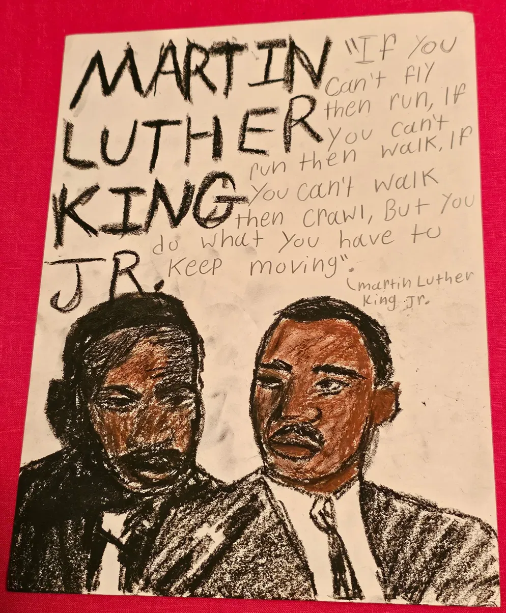 A second child's drawing of Martin Luther King Jr. with one of his quotes